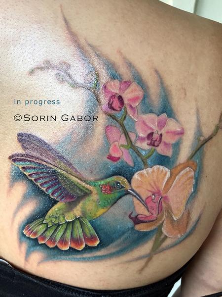 Sorin Gabor - realistic color hummingbird and orchids tattoo